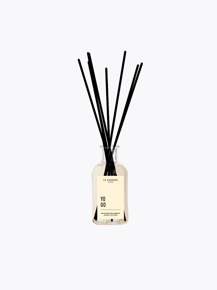 Diffuser bottle with black sticks on a white background